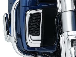 Blue motorcycle engine part with chrome accents and black air intake grill.