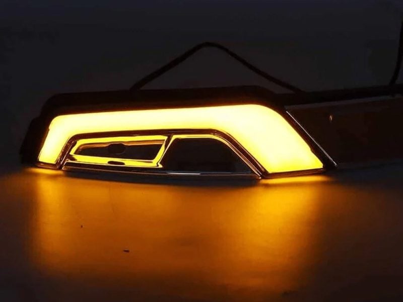 Bright yellow LED motorcycle tail light for Revelry Motorcycles, custom bike lighting, high visibility safety light.