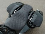 Comfortable black quilted motorcycle seat with side storage compartments for Revelry Motorcycles in Australia.