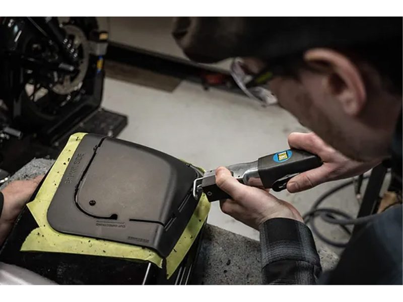 High-quality motorcycle repair on a Revelry Motorcycles custom bike in studio setting.