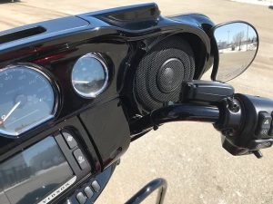High-quality motorcycle dashboard with audio system and handlebar controls at Revelry Motorcycles.