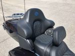 Harley-Davidson motorcycle seat with backrest and quilted leather detailing.