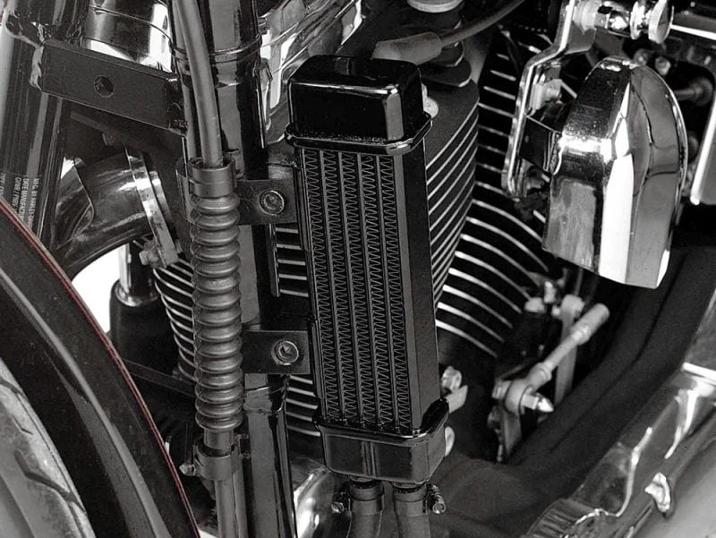 High-performance motorcycle radiator with black cooling fins, essential for optimal engine temperature management.