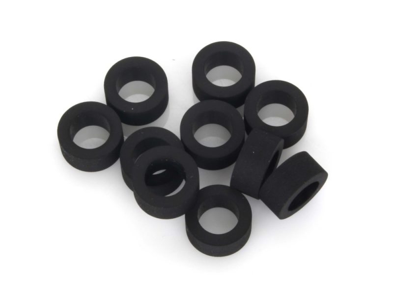 Rubber bushings for motorcycle suspension or frame parts.