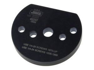 Black motorcycle spacer with multiple holes, suitable for vintage and custom bikes.
