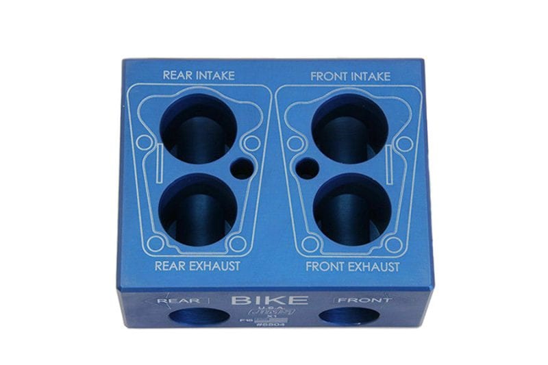 Aluminium motorcycle exhaust port block for bike performance tuning.