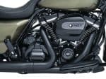 Vivid black and olive green motorcycle engine with 107 cubic inch badge, showcasing premium build quality.