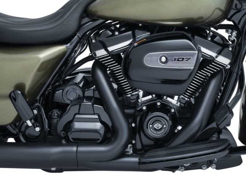 Vivid black and olive green motorcycle engine with 107 cubic inch badge, showcasing premium build quality.
