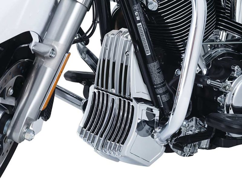 Sleek chrome motorcycle engine with stylish cooling fins and black accents.