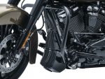 Harley-Davidson motorcycle engine with black and chrome finish, showcasing high-performance parts.