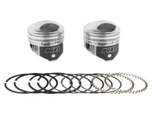High-performance motorcycle piston set with piston rings and wrist pins for Honda CR models.