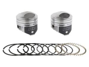 High-performance motorcycle pistons with piston rings and connecting pins for custom bike builds.