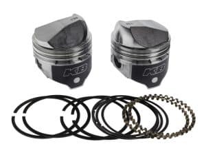Piston kit with piston rings and clips for motorcycle engine rebuild at Revelry Cycles.