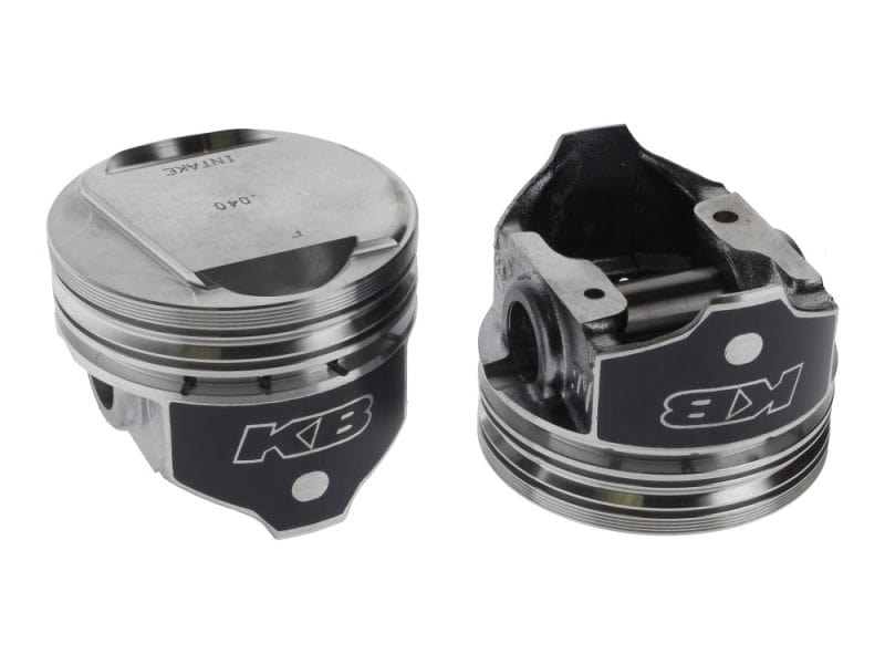 High-performance motorcycle pistons with KEBC branding for revving power.