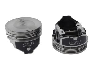 Piston set for motorcycle engine, high-performance bike parts from Revelry Cycles.