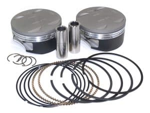 High-performance motorcycle piston set with rings and pins for Harley Davidson engines.