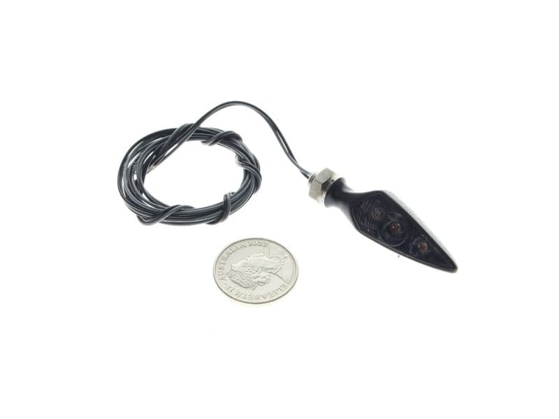 Rhombus S Dark LED Right Hand Front / Left Hand Rear Turn Signal - Black. Tiny black motorcycle turn signal with wiring and connector, compact vehicle lighting part.