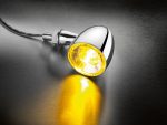 Chrome motorcycle LED indicator light with yellow illumination for Revelry Motorcycles.