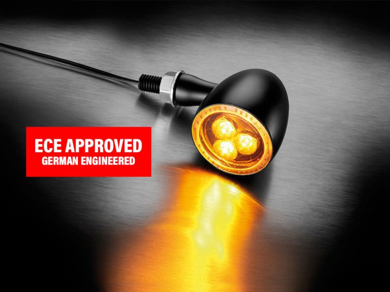 High-performance motorcycle LED indicator light with black housing and bright amber LEDs, ECE approved, German engineered design.
