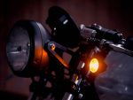 High-quality motorcycle headlight and turn signal on a custom Revelry motorcycle, showcasing Australian bike craftsmanship.