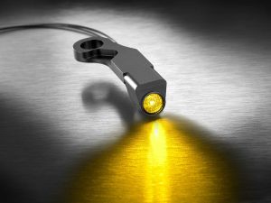Compact motorcycle LED indicator light with yellow glow, ideal for motorcycle safety and visibility.