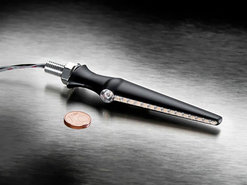 High-quality motorcycle LED indicator with wiring and chrome details.