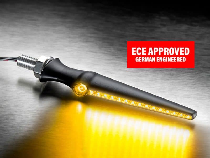 LED motorcycle indicator with ECE approval, German engineering, black handle, bright yellow light.