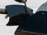 Sleek black motorcycle fairing with aerodynamic design and high-quality finish.