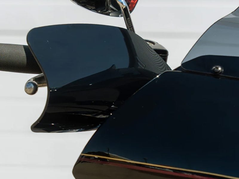 Sleek black motorcycle fairing with aerodynamic design and high-quality finish.