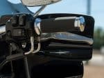 Sleek motorcycle handlebar with black grips and chrome accents, perfect for Harley or cruiser bikes.
