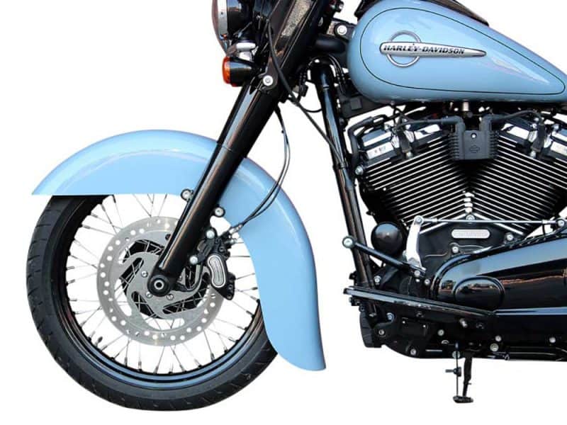 Bright blue Harley-Davidson motorcycle front wheel and fork with disc brake, showcasing quality design.