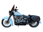 Harley Davidson motorcycle with black leather saddlebags, blue paint, and chrome detailing.