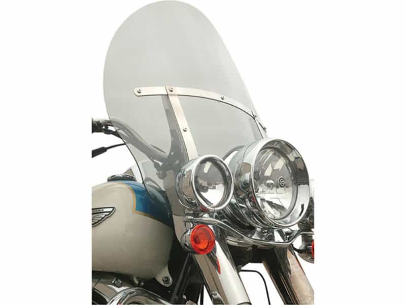 20in. Billboard Flare Windshield - Tinted. Fits FL Softail 2000-2017 & Freewheeler Trike 2017up. Motorcycle front view with windshield and chrome headlights, ideal for motorcycle rides and touring.
