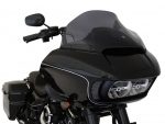 Black touring motorcycle with aerodynamic windshield and sleek design for long-distance rides.
