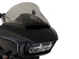 Dark motorcycle fairing with dual headlights and tinted windscreen, stylish design for custom bike enthusiasts.