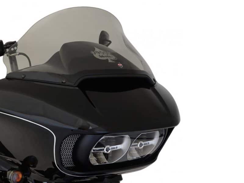 Dark motorcycle fairing with dual headlights and tinted windscreen, stylish design for custom bike enthusiasts.