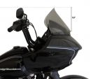 Black motorcycle tourer with a windshield and handlebar accessories.