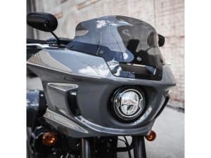 Veloce grey motorcycle with aerodynamic fairing and advanced headlight design for optimal touring.