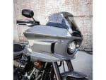 Sleek grey motorcycle with tinted windshield and modern design, ideal for motorcycle enthusiasts.