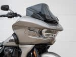 Sleek grey Harley Davidson touring motorcycle with advanced windscreen, perfect for long rides.