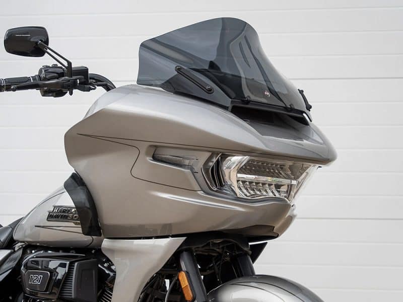 Sleek grey Harley Davidson touring motorcycle with advanced windscreen, perfect for long rides.