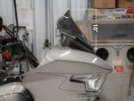 Sleek motorcycle windscreen on a grey Revelry Motorcycle, perfect for touring and cruising.