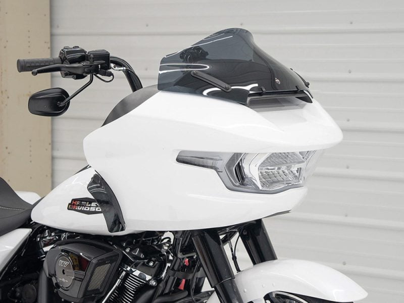High-quality Harley-Davidson touring motorcycle with sleek white and black design, perfect for long rides.