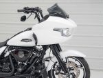 Motorcycle front view showcasing Harley-Davidson style black and white custom touring bike with modern design and advanced features.
