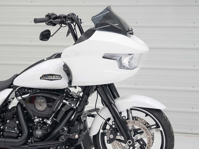 Motorcycle front view showcasing Harley-Davidson style black and white custom touring bike with modern design and advanced features.