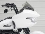 Harley-Davidson motorcycle with advanced white fairing and tinted windshield.