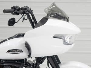 Harley-Davidson motorcycle with advanced white fairing and tinted windshield.