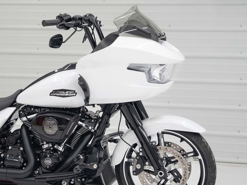 Harley Davidson touring motorcycle with custom white paint, advanced aerodynamics, and black engine details.