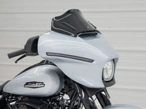 Modern Harley-Davidson touring motorcycle with sleek custom fairing for advanced touring comfort and style.