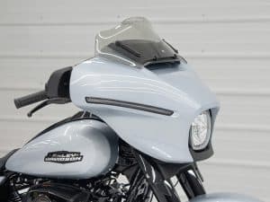 Sleek Harley-Davidson motorcycle with custom fairing and windscreen, perfect for Australian motorcycle enthusiasts.